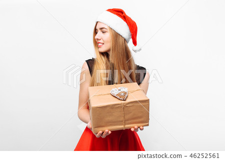 woman in santa hat and dress celebrating new year woman in santa hat and dress celebrating new year 46252561