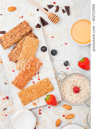 Organic cereal granola bar with berries on marble  46252969