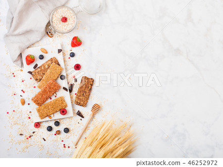 Organic cereal granola bar with berries on marble  46252972