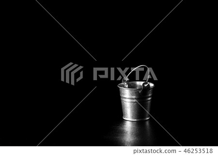 Metal bucket on black background 46253518