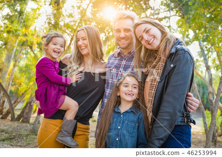 Mixed Race Family Members Having Fun Outdoors 46253994