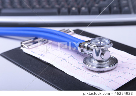 Stethoscope on a modern keyboard, RX prescription on white table with space for text 46254928