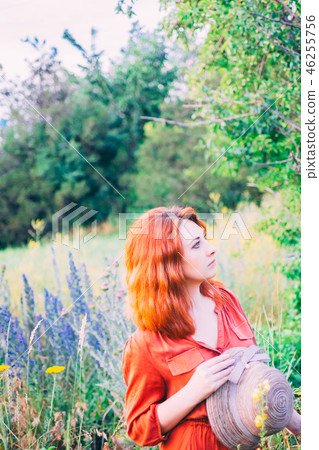 Girl on dandelion on green field. Girl on dandelion on green field. 46255756