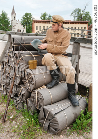Retro picture with soldier sitting on the bundles 46256803