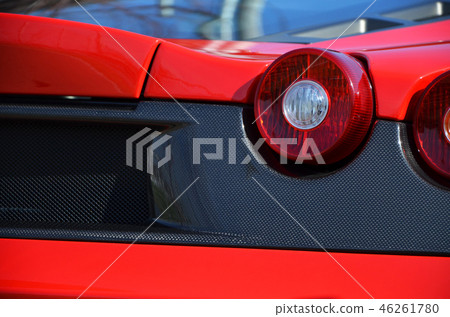 Back shot of a red sports car [car] 46261780