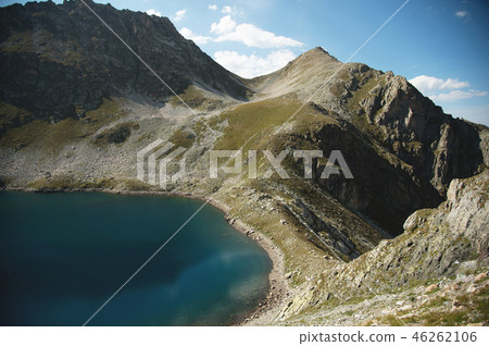 Landscape of highland lake high in the mountains of Dombai. Circus formed by a glacier with a deep Landscape of highland lake high in the mountains of Dombai. Circus formed by a glacier with a deep 46262106