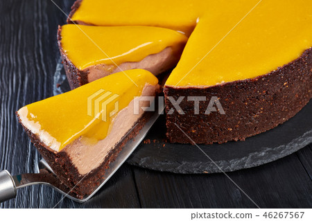 sliced chocolate mango cheesecake, top view sliced chocolate mango cheesecake, top view 46267567