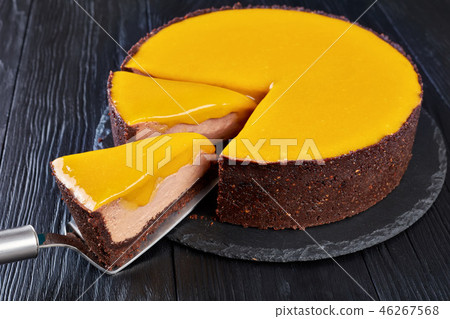 sliced chocolate mango cheesecake, top view sliced chocolate mango cheesecake, top view 46267568