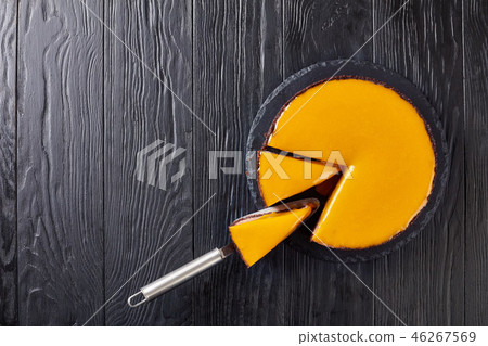 tasty chocolate mango cheesecake, close up tasty chocolate mango cheesecake, close up 46267569