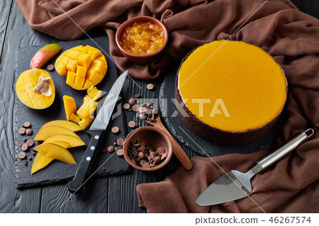 tasty chocolate mango cheesecake, close up tasty chocolate mango cheesecake, close up 46267574