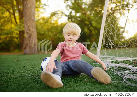 Little boy got injured playing footbal Little boy got injured playing footbal 46268267