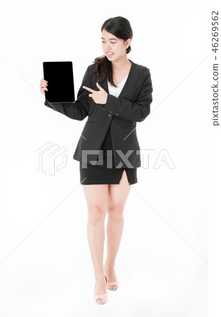 Portrait Asian young businesswoman showing tablet and finger poi Portrait Asian young businesswoman showing tablet and finger poi 46269562