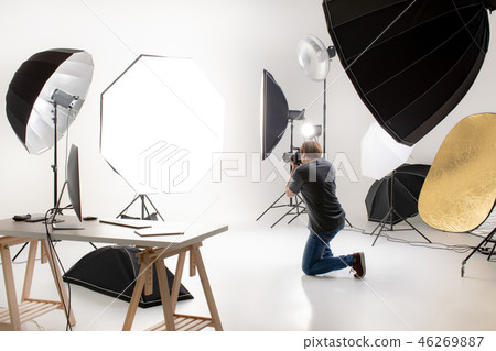 Photographer is working in studio. Photographer is working in studio. 46269887