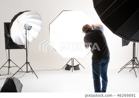 Photographer is working in studio. 46269891