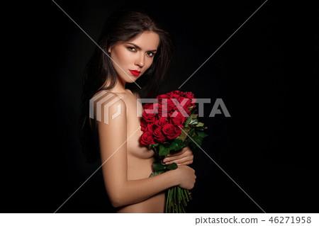 beautiful young woman with a large bouquet of red roses 46271958