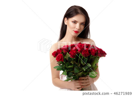 beautiful young woman with a large bouquet of red roses beautiful young woman with a large bouquet of red roses 46271989