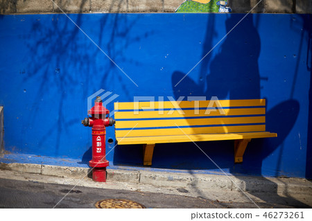 Yellow chair, hydrant, blue wall Yellow chair, hydrant, blue wall 46273261