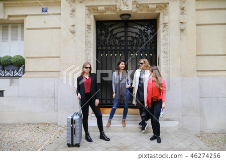 Happy students leaving university building in . Happy students leaving university building in . 46274256
