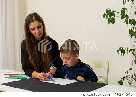 little boy draws markers from lesson mother little boy draws markers from lesson mother 46274546