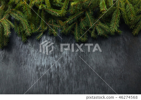 spruce and black background. Wooden background spruce and black background. Wooden background 46274568
