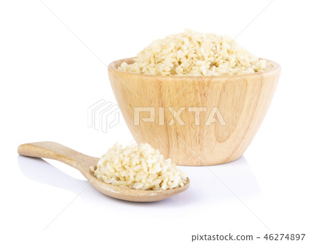 Brown rice in the wood bowl and spoon isolated Brown rice in the wood bowl and spoon isolated 46274897