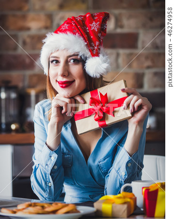 Beautiful young woman in Santa Claus hat Beautiful young woman in Santa Claus hat 46274958