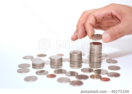 A man hand stacking coins A man hand stacking coins 46275109