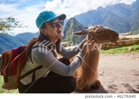 Smiling tourist woman with lama Smiling tourist woman with lama 46276840