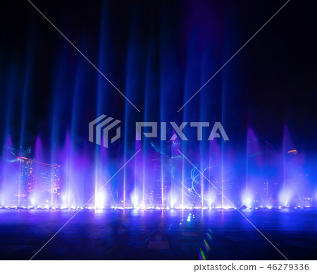 Colorful lights with blurry fountain, water show on black backgr 46279336
