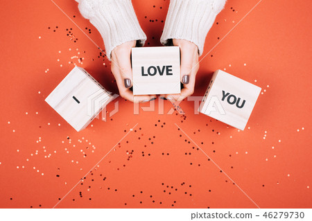 Wonans hands holding cubes with text I Love You. Wonans hands holding cubes with text I Love You. 46279730