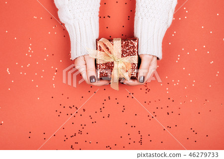 Gift box with bow in woman's hands. Gift box with bow in woman's hands. 46279733