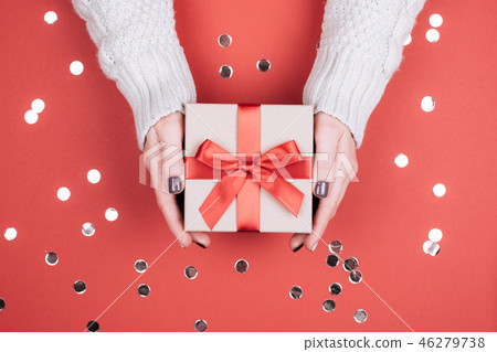 Gift box with bow in woman's hands. Gift box with bow in woman's hands. 46279738