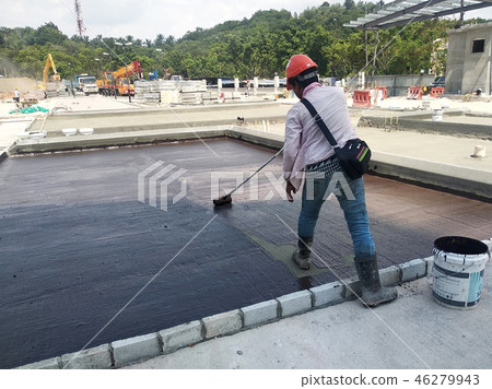 Waterproofing membrane applied by workers Waterproofing membrane applied by workers 46279943