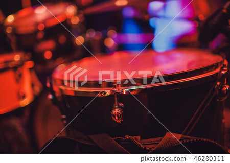 Drum kit on stage in the spotlight color. Drum kit on stage in the spotlight color. 46280311