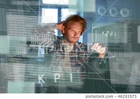 Young concentrated computer developer writing new code 46281973