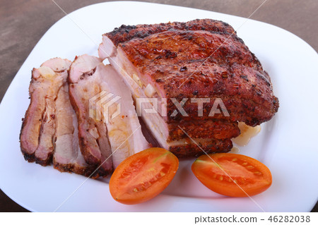 grilled pork chops with tomato and ketchup on plate. grilled pork chops with tomato and ketchup on plate. 46282038