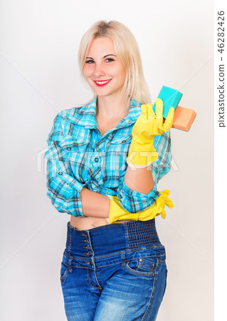 Happy housekeeper demonstrate sponges for washing Happy housekeeper demonstrate sponges for washing 46282426