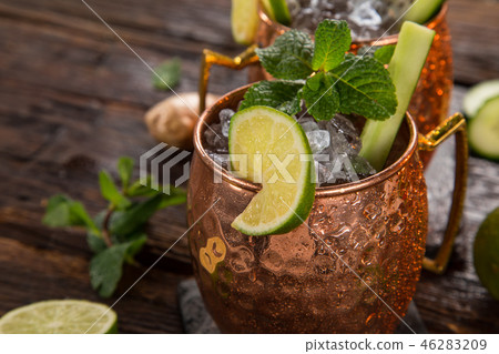 Famous Moscow mule alcoholic cocktail in copper mugs. 46283209