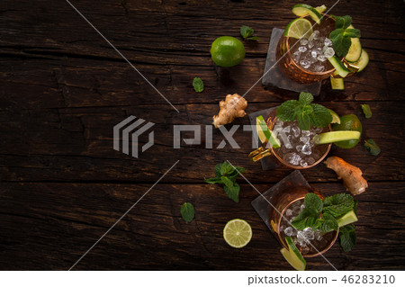 Famous Moscow mule alcoholic cocktail in copper mugs. 46283210