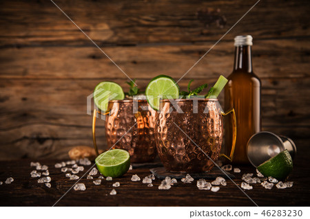 Famous Moscow mule alcoholic cocktail in copper mugs. 46283230
