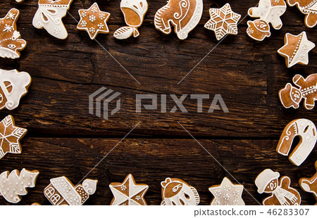 Christmas homemade gingerbread cookies on old wooden table. Christmas homemade gingerbread cookies on old wooden table. 46283307