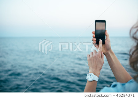 Candid image female capturing her vacation 46284371