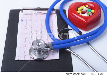 RX prescription, Red heart, asorted pils and a stethoscope on white background 46284386