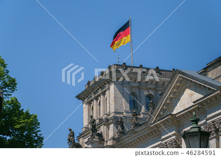 German flag on tower, top of Reichstag building in Berlin, Germany. German flag on tower, top of Reichstag building in Berlin, Germany. 46284591
