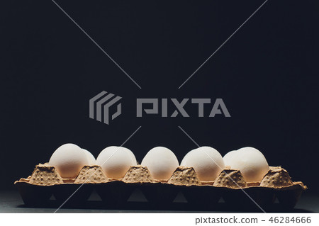 Several white eggs in an egg carton. Several white eggs in an egg carton. 46284666