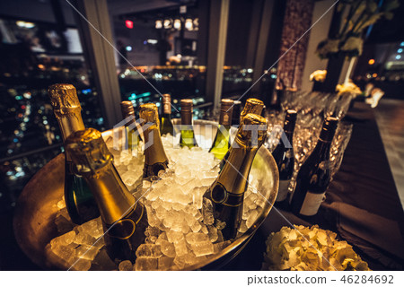 Champagne wine bottles on ice on catering table Champagne wine bottles on ice on catering table 46284692