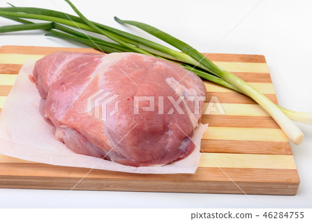 pork steaks with fat. Meat is on wooden board with spice as pepper and green spring onion. Ready for pork steaks with fat. Meat is on wooden board with spice as pepper and green spring onion. Ready for 46284755