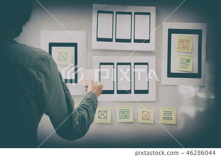 user experience UX designer designing web on mobile phone tablet layout. UI planning mobile application. developer work with business prototype user experience UX designer designing web on mobile phone tablet layout. UI planning mobile application. developer work with business prototype 46286044