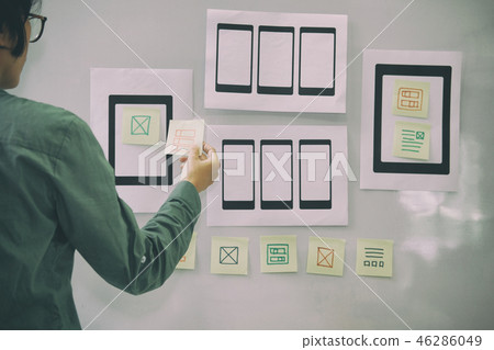 user experience UX designer designing web on mobile phone tablet layout. UI planning mobile application. developer work with business prototype user experience UX designer designing web on mobile phone tablet layout. UI planning mobile application. developer work with business prototype 46286049