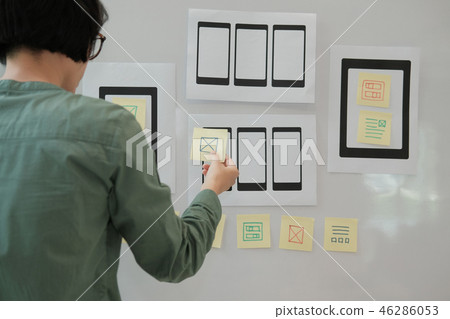 user experience UX designer designing web on mobile phone tablet layout. UI planning mobile application. developer work with business prototype user experience UX designer designing web on mobile phone tablet layout. UI planning mobile application. developer work with business prototype 46286053